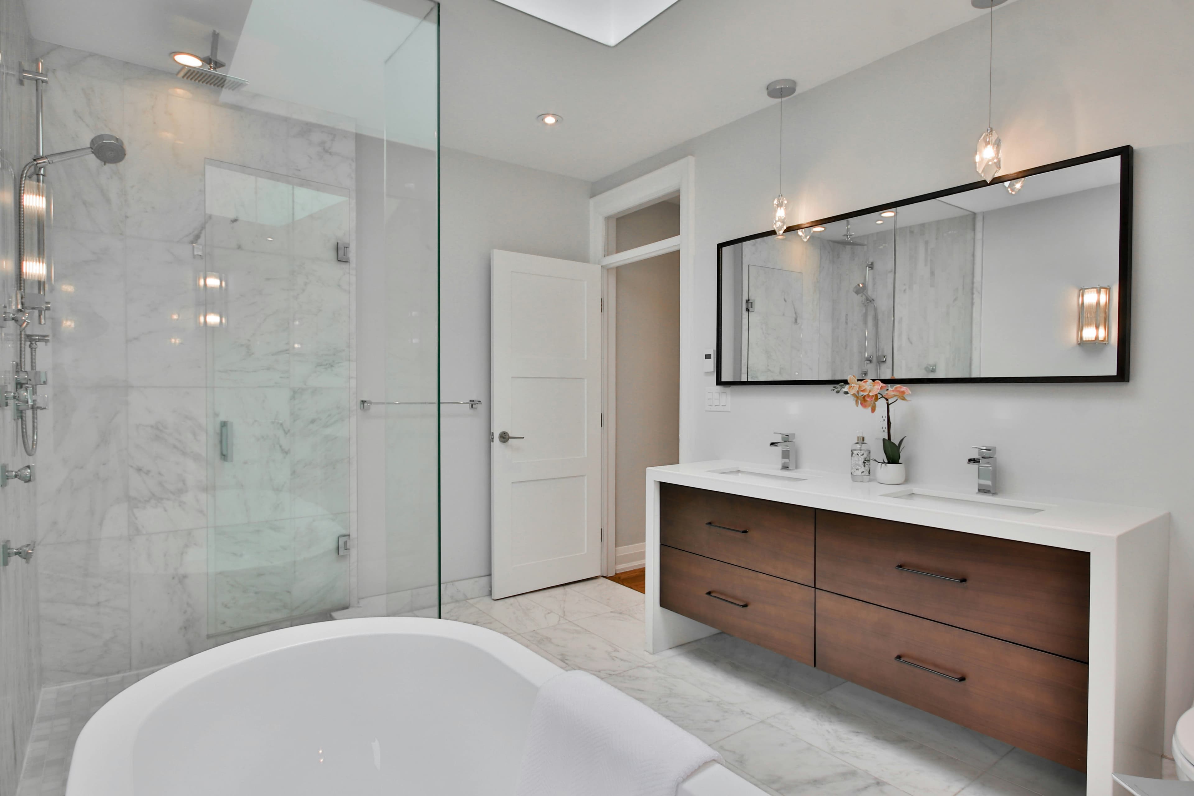 Luxury walk-in shower with pristine tile and grout